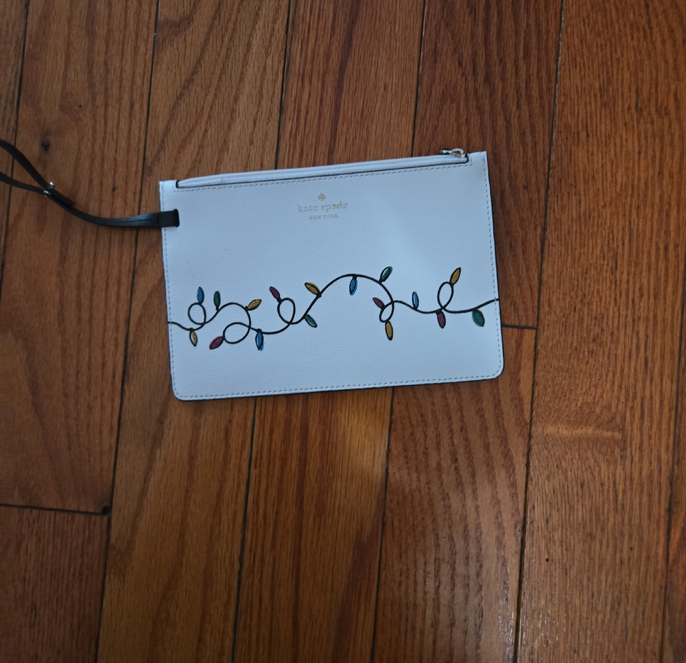 kate spade White Wristlet with Multicolor Light String Motif
